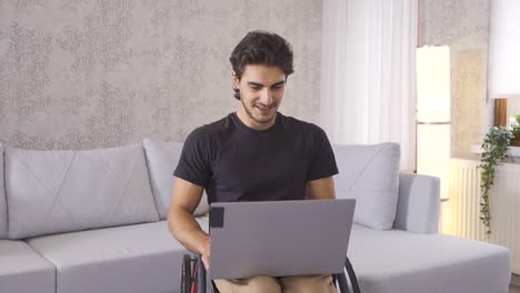 Disabled-teenager-making-video-call-in-slow-motion.